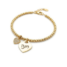 צמיד  עם כדורי זהב ותליון לב